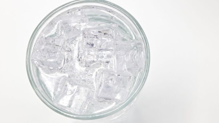 Glass of clean drinking water with ice, representing unregulated contaminants in drinking water testing