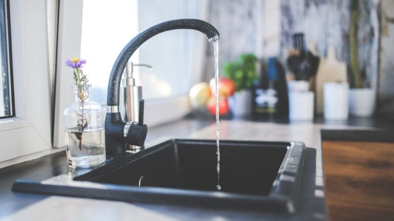 Boil water advisory kitchen tap, running water from a faucet during a water quality warning